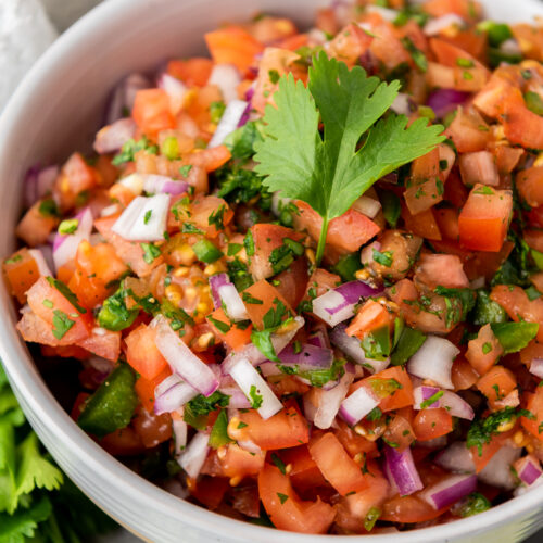 homemade salsa in a white dish.